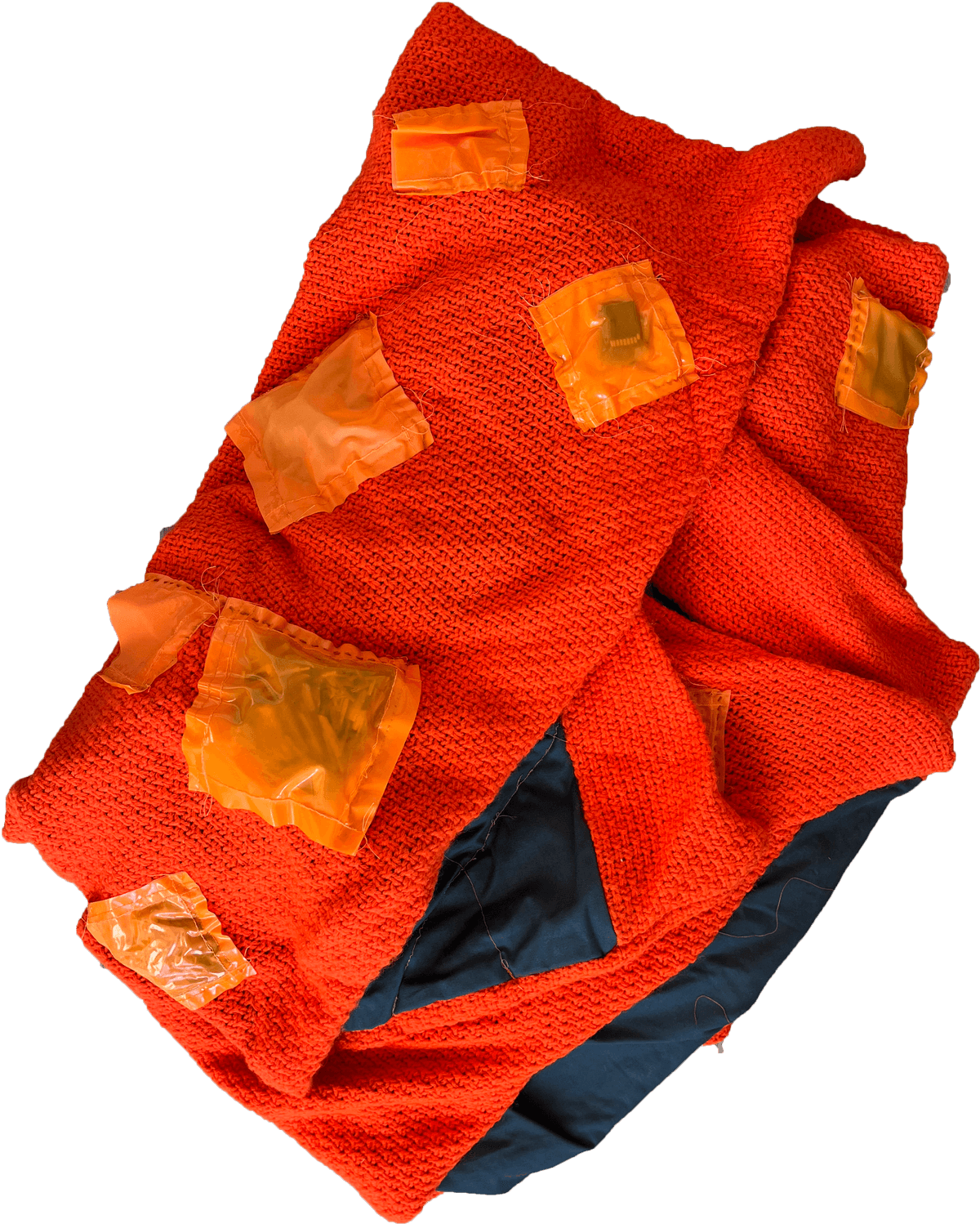 2. This is the weighted blanket “A Data Set of Weight” from Ren Loren Britton & Iz Paehr. The blanket is made out of a thick knitted fabric and a thin cotton. Sewn onto the blanket in a series of pockets are various objects that have various weights. Laying under it, you feel the weight of this specific data set.